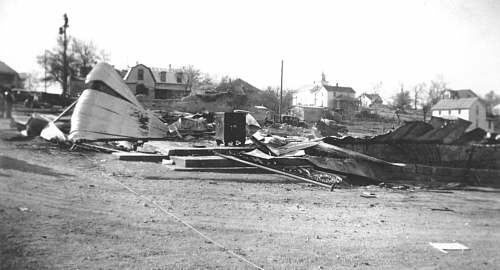  Main StreetAdams & Casey Store with their safe on the front porch.  The white house at extreme right was the home of Josephine Shockley Blankenship. 